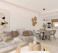 Living room in a holiday apartment with a kitchenette and a floor with a wooden decor.