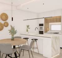 A kitchen in a holiday apartment with a dining table and minimalist wall decor.