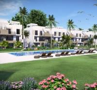 Recreational apartment in Guardamar del Segura with a pool, palm trees, and sun loungers in the garden.