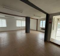 Spacious commercial spaces with ceramic flooring and large windows, ideal for rent.