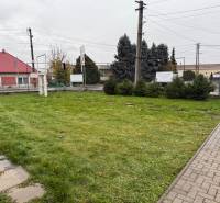 Land with a lawn in Dolné Chlebany on Dolné Chlebany Street near commercial spaces.