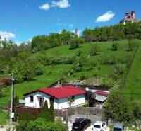 Family house at 8. mája 2810/6A Street in Banská Štiavnica, surrounding green hills and the calvary.
