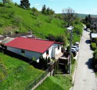 A family house on 8. mája Street 2810/6A in Banská Štiavnica, surrounded by greenery and a garden.