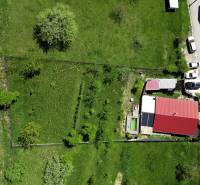 Aerial view of a family house with a red roof and garden on 8th May Street in Banská Štiavnica.