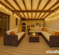 A terrace of a family house with wicker seating, lights, and an oven, flooring with a wooden decor.