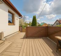 A family house in Banská Štiavnica on 8. mája Street 2810/6A with a terrace and wooden decor.