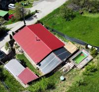 A family house in Banská Štiavnica on 8. mája Street 2810/6A with a red roof and a garden.