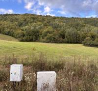 Greenery and electrical boxes on plots in Margecany, ideal for living.