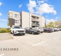 Parking lot in front of the apartment building in Blatná na Ostrove near the 3-room apartment.