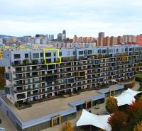 Apartment building on Rusovská Road in Bratislava - Petržalka surrounded by urban development.
