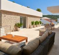 The terrace of the villa in the town of Bol offers comfortable seating and a view of the surroundings.