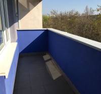 A balcony in a 1-room apartment on Tomášikova Street in Bratislava - Ružinov with a blue wall.