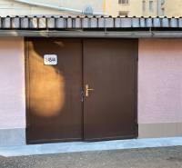 Brown garage doors on Mlynská Street in the Staré Mesto district in Košice.