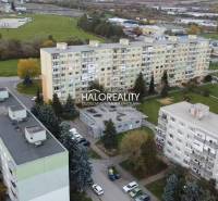 An aerial view of the housing estate in Rimavská Sobota with apartment buildings and greenery.