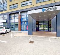 Office building on Košická Street, Bratislava - Nivy, with a parking lot in front of the entrance.