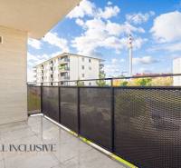 The balcony of a 2-room apartment in Panónsky háj in Dunajská Streda with a view of residential buildings.