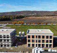 Construction project on Dúhová Street in Slovenský Grob, surrounded by nature and open countryside.