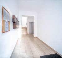 Apartment entrance with mailboxes and elevator, suitable for a 2-room apartment.