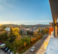 View from Vajanského Street in Modra of the surrounding landscape and residential buildings.