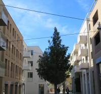Residential buildings on Floriánska Street in Bratislava - Old Town with a cobblestone road.