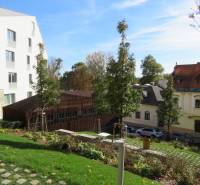 Garden and architecture on Floriánska Street, Bratislava - Old Town, with a view of a 3-room apartment.