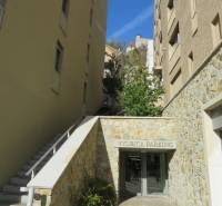 Outside in Bratislava on Floriánska, there is an entrance to a parking lot.