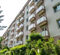 An apartment building with balconies surrounded by greenery on Vodárenská Street in the Košice-Sever district.