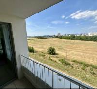 View from the balcony of fields and the city in Bratislava on Labutia Street, Petržalka.