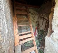 Old stairs to the attic with wooden decor in a family house.