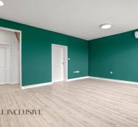 A room with a wooden floor design, green walls, and air conditioning, 2-room apartment.