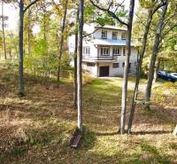 A cottage in the forest at Gazárka in Šaštín-Stráže surrounded by trees and nature.