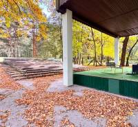 Amphitheater with a stage and benches, the environment of the Cottage in Šaštín-Stráže at Gazárka.