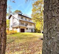 A cottage on Gazárka Street in Šaštín-Stráže surrounded by autumn nature and trees.