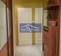 A hallway in a 2-room apartment with storage space and a light-colored floor.