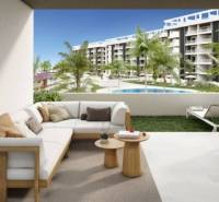 Terrace of a recreational apartment in Torrevieja with a view of the pool and greenery.