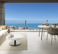 The veranda of the recreational apartment in Torrevieja with a view of the sea and comfortable seating.