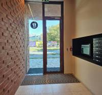 Entrance hall with mailboxes and a brick wall on Košicá Street, in Bratislava - Ružinov.