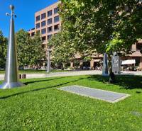 Greenery and metal sculptures in front of the building in Bratislava - Ružinov on Košická Street, 3-room apartment.