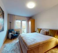 A bedroom in a 2-room apartment with a decorative painting on the wall and a comfortable bed.