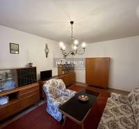 Living room with antique furniture and a chandelier in a 4-room apartment.