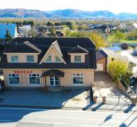 A family house in Bolešov with a garden and a view of the surrounding mountains.