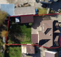 Aerial photograph of a family house in the village of Bolešov surrounded by a garden and a driveway.