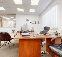 An office with furniture and decorations, a floor with a wooden design, ideal commercial space.