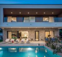 A villa in Bale with a pool and terrace, surrounded by greenery and relaxation areas.