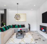 Living room with a comfortable sofa, fireplace, and decorations in the Villa.