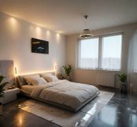 Bedroom with wood-patterned flooring, large bed, plants, and recessed lighting.