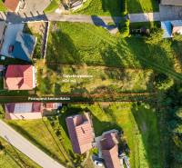 Aerial view of a building plot in Turzovka, Residential land, with access road.