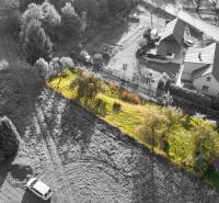 Plots - residential in Turzovka with grass cover and surrounding family houses.