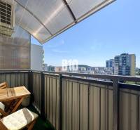 Balcony of a 4-room apartment in Nitra with a view of the surrounding panel buildings.