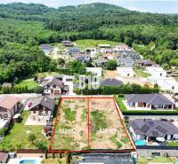 Land - housing in Štitáre, surrounded by houses and forests, ready for construction.